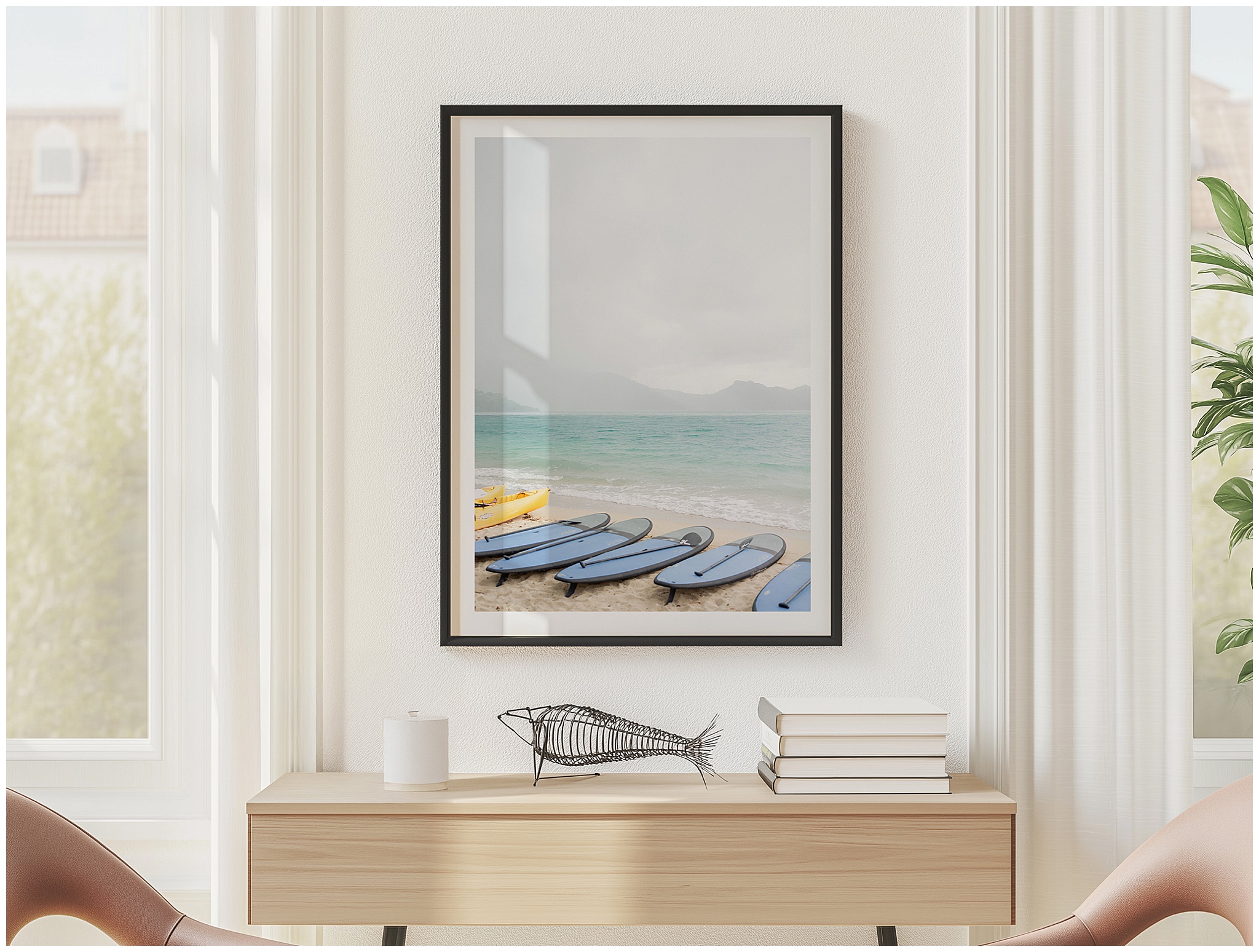 Mockup featuring a framed Hayman Island landscape print with paddle boards on the shoreline, styled above a modern sideboard to showcase how the artwork looks displayed in a home.